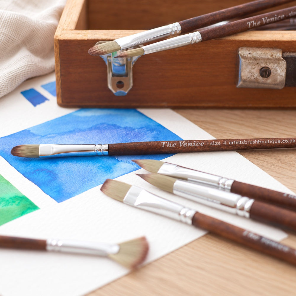 Venice brushes on a watercolour sketch, each handle marked with its size