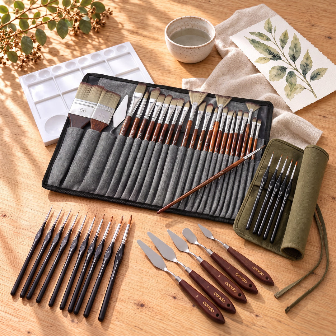 The Complete Brush Bundle on an oak table: the Venice 25 brushes in their grey case, 10 Finesse detail brushes, 5 palette knives and a mixing tray, with the free canvas roll and 5 Finesse brushes