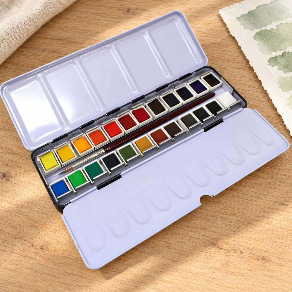 The Artway tin of 24 watercolour paints, open on the table