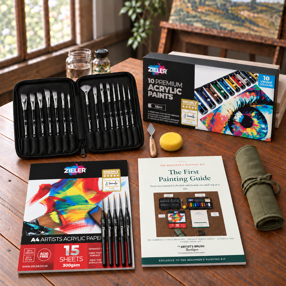 The Beginner's Painting Kit on a studio table: 15 Cambridge brushes, 10 Zieler acrylic paints, A4 acrylic pad and The First Painting Guide